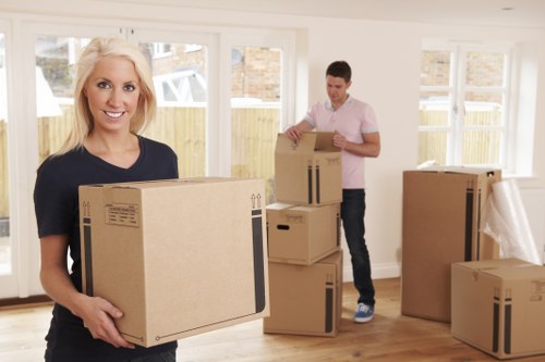 Professional movers handling office furniture during a commercial move