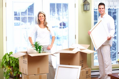 Professional movers handling large furniture