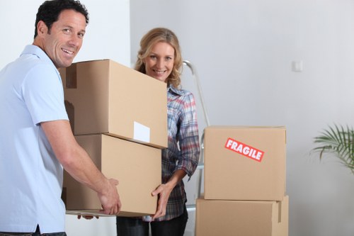 Packers carefully wrapping fragile items